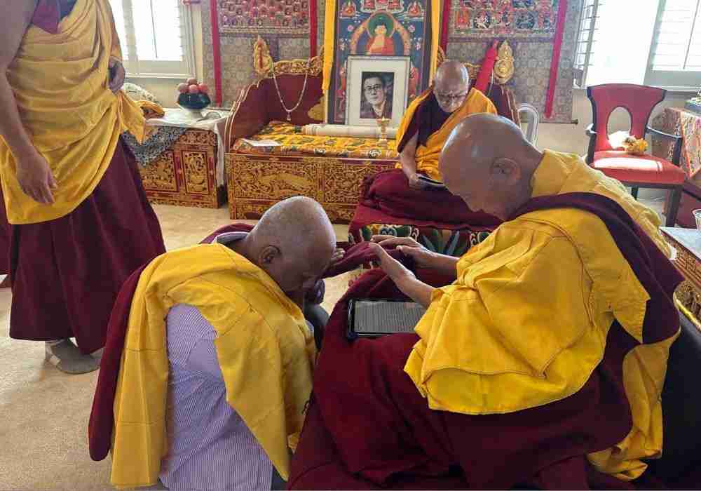 Offering robes to be blessed.